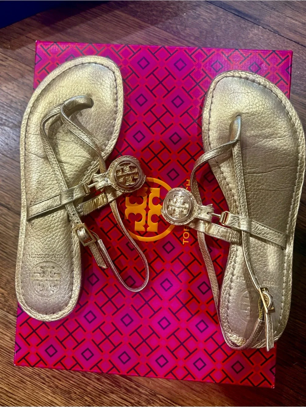 Tory Burch Metallic Gold Leather Logo T-Strap Sandals with Medallion Detail